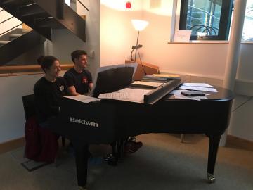 My office mates, Frazer and Rose, playing a duet on the Ertegun piano